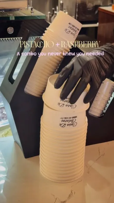 Stack of branded Casa Di Gelatos cups at the counter